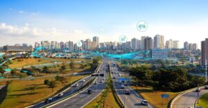 Vista aérea de São José dos Campos com fluxos de dados representando o uso da geoinformação em mobilidade e gestão urbana.